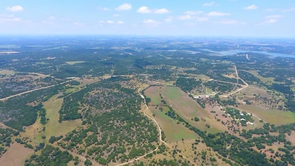 Aerial view of the ranch with stock pond